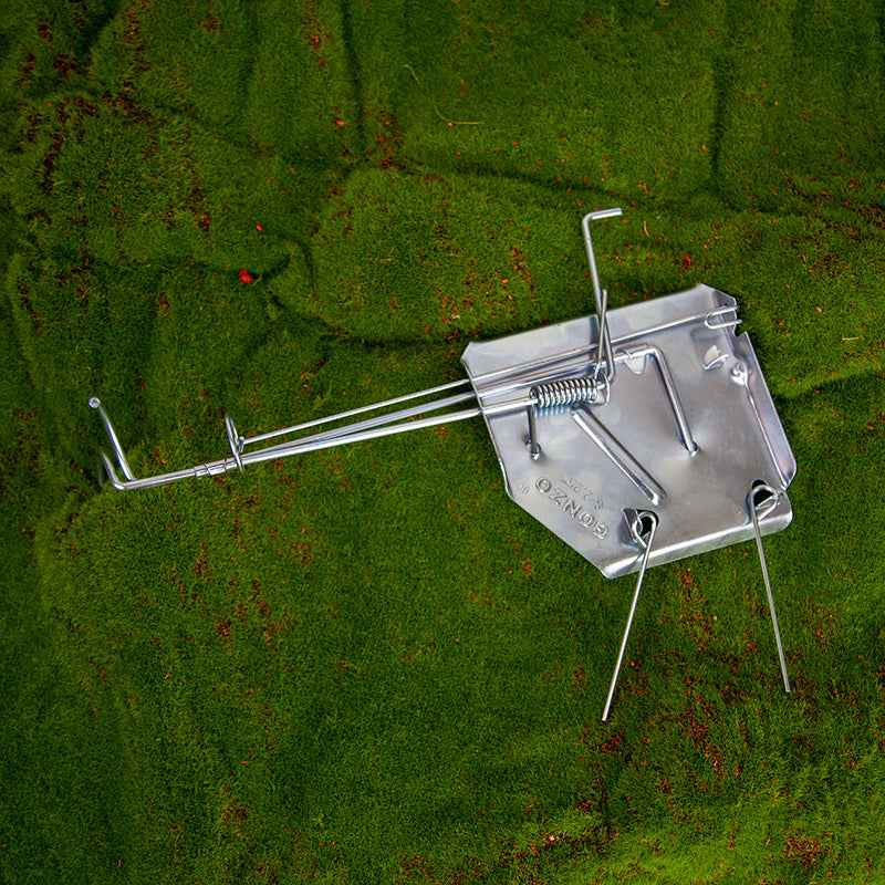 SureFire Gopher Trap photo on a grassy background - trap closed