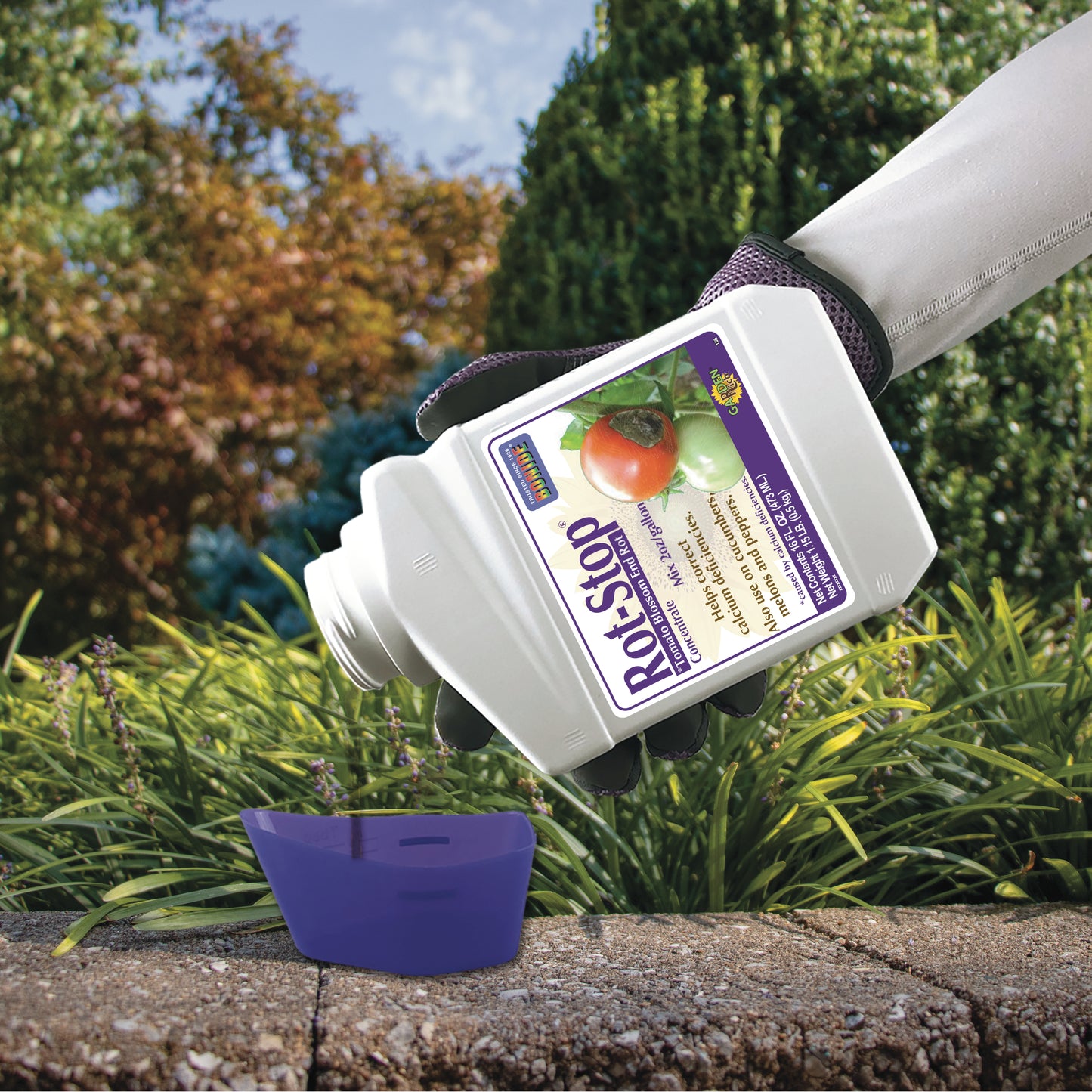 Applying Bonide Rot-Stop Concentrate to garden plants