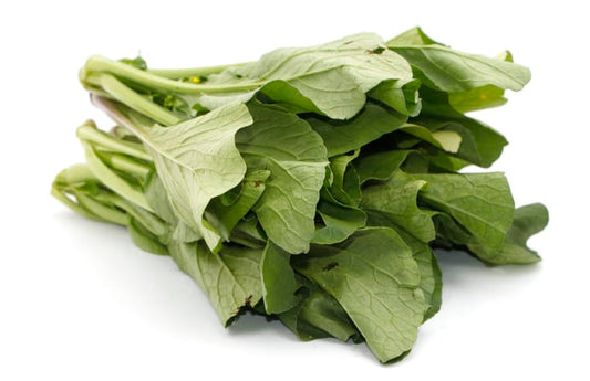 Bunch of leafy mustard greens isolated on white background