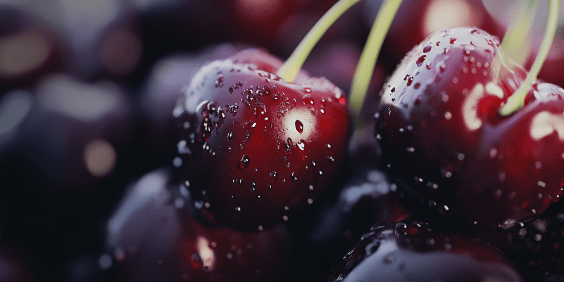 Dark red cherries covered with water droplets
