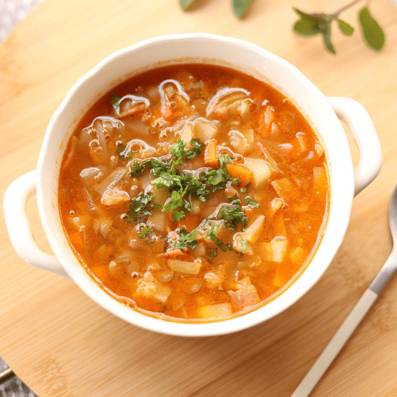 Bowl of minestrone soup with dried vegetables