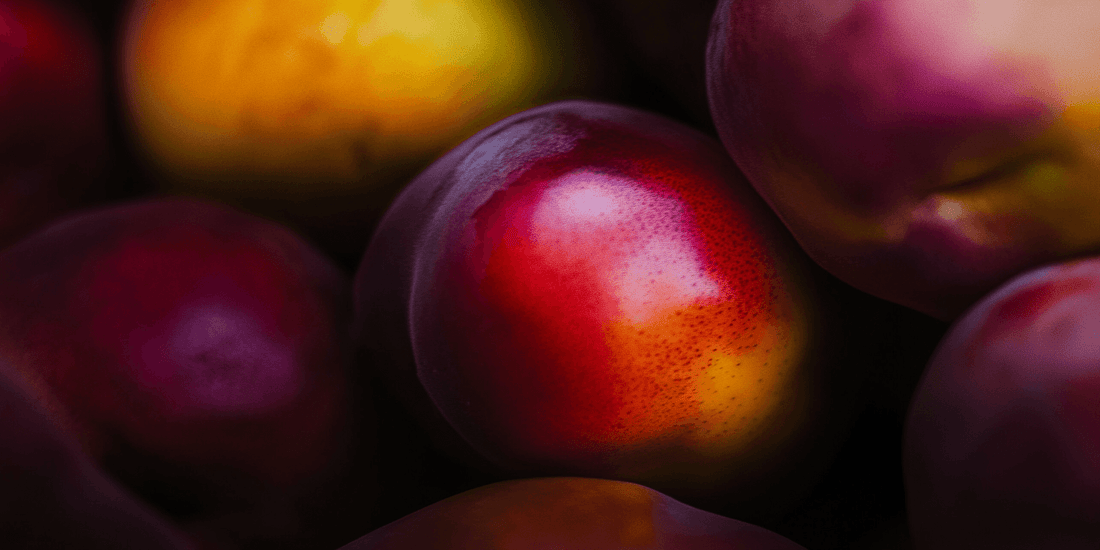 Pile of ripe red and yellow nectarines