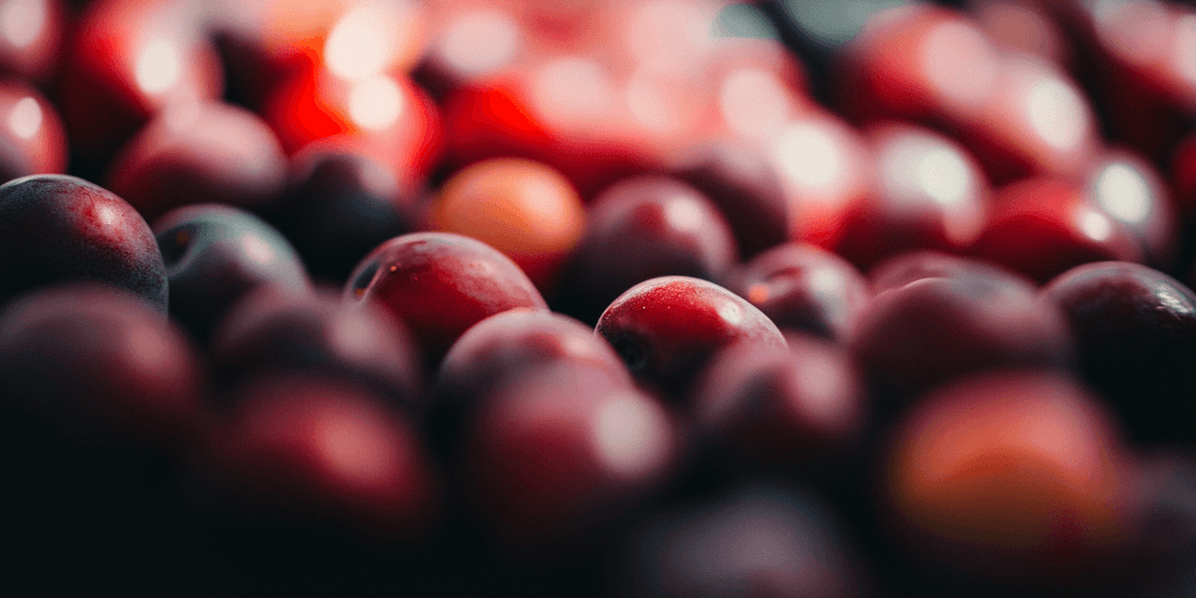 Pile of ripe red plums