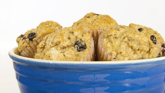 Blueberry oat muffins in a blue bowl