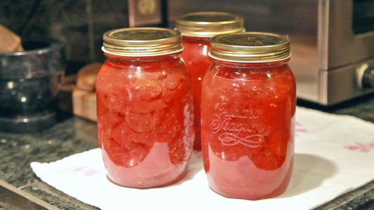 Two jars of home-canned tomatoes