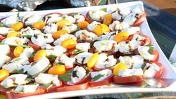 Tray of tomato, mozzarella, and basil caprese salad