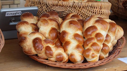 Braided loaves of challah bread in a basket