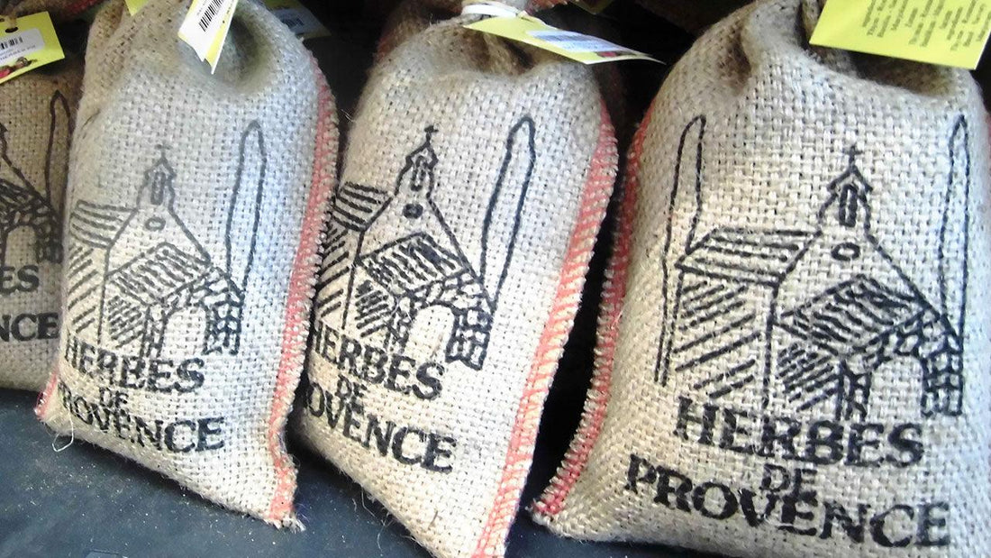 Three cloth sacks labeled Herbes de Provence