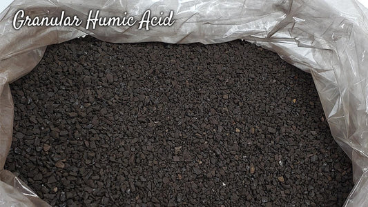 Open bag of dark granular humic acid