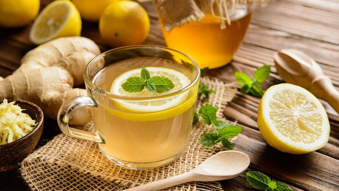 Cup of lemon-ginger kombucha with fresh ginger