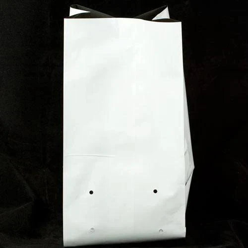 White nursery grow bag with a drainage hole
