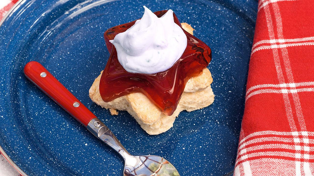 Red, white, and blueberry dessert on a blue plate