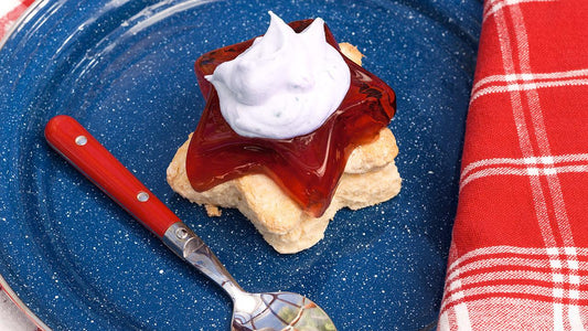 Red, white, and blueberry dessert on a blue plate