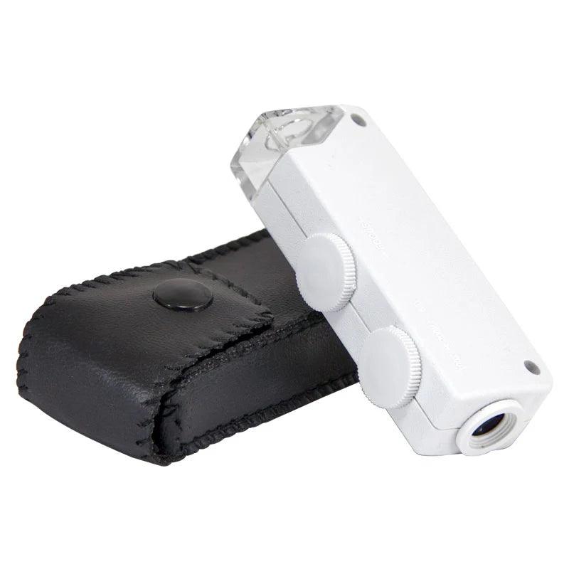 White pocket microscope with black carrying case