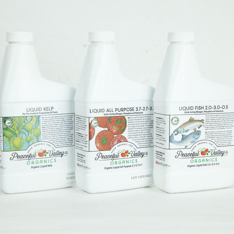 Bottles of Peaceful Valley liquid fertilizer