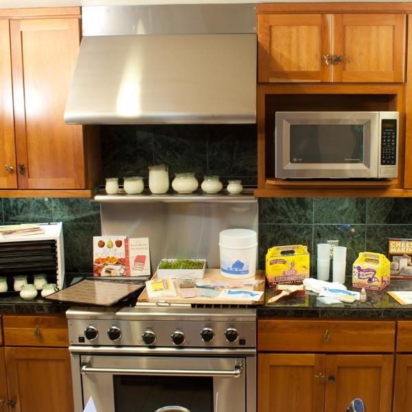 Jars of preserved food arranged in a kitchen