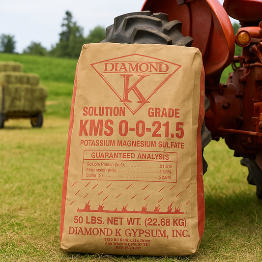 Diamond K Brand KMS 0-0-21.5 (50 lb) Fertilizer next to a tractor