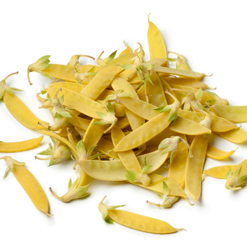A large pile of yellow Sugar Pod Peas isolated on a white background