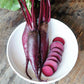 Three Whole beets with a selection of them sliced and presented