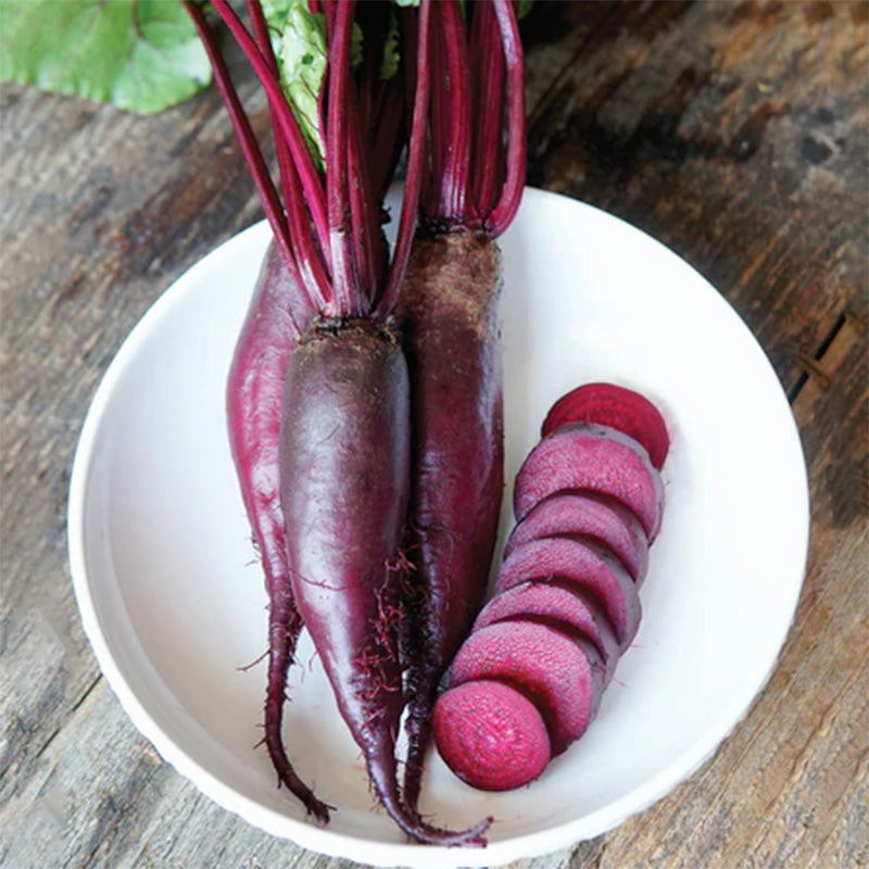 Three Whole beets with a selection of them sliced and presented