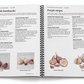 Illustrative open-book view of the coil-bound Fall 2026 catalog showing two facing garlic variety pages